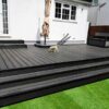 Graphite Grey Composite Decking In raised Garden With Steps & Artificial Grass