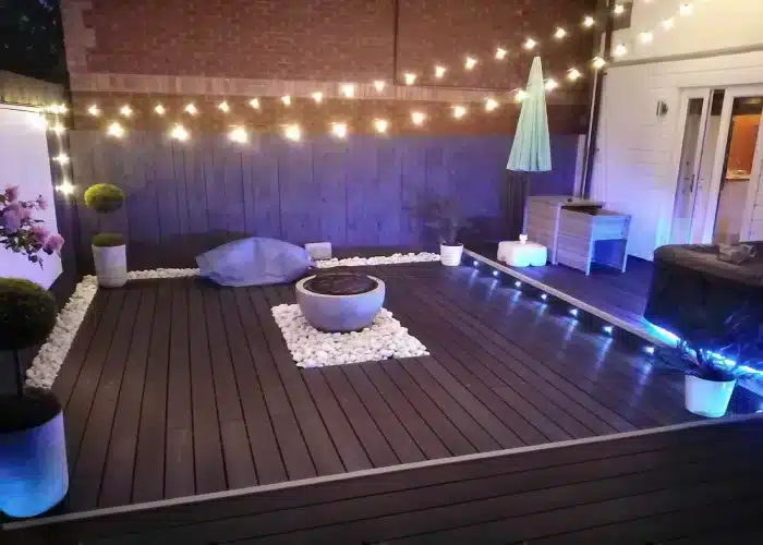 Small Garden Ideas Using Brown Composite Decking With Fire Pit & Cinema Projector