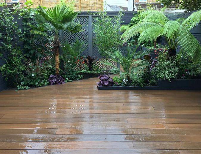 Wet composite decking with plants by the side