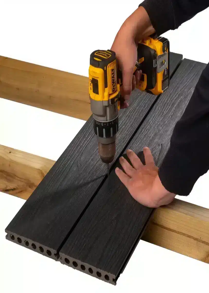Installing Composite Decking Boards Onto Wooden Joists Using Composite Decking Clips And A Power Drill