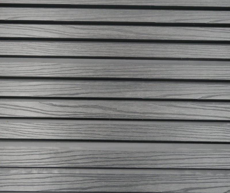 Batten/Slatted Cladding In Wood Grain Finish In Dark Grey Joined Together