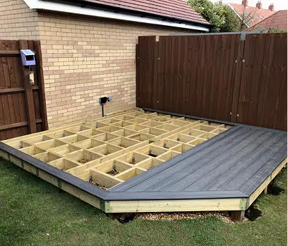 Wooden Joists With Decking Boards Being Installed