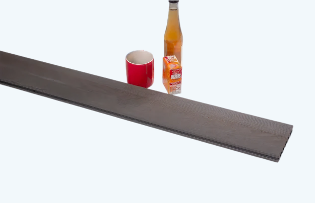 Image of cup, bottle vinegar , baking soda and composite board grey