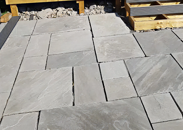 Laying of decking tiles