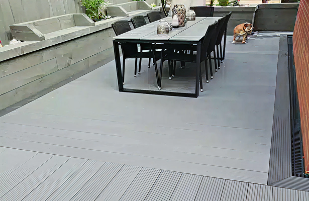 Grey Grooved Composite Decking With Dark Boarder & Table