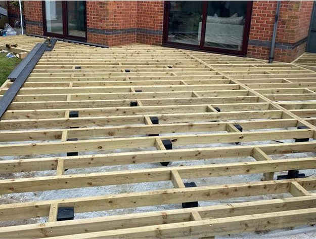 C16 Wood joists with painted post and no-woven weed membrane