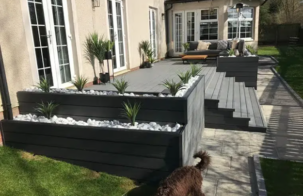 Raised Deck With Tropical Plants, Steps & Dog Walking Across