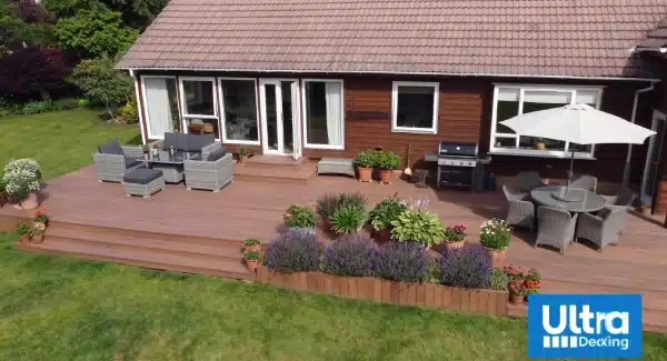 Ipe Brown decking with garden furniture and steps used in natural cottage setting