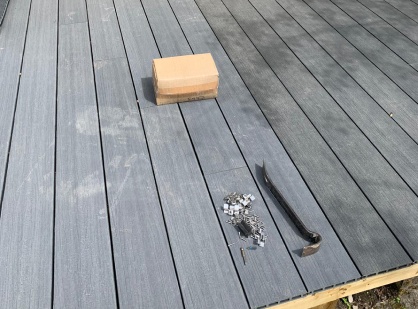 Using Prying Tool To Remove Nails