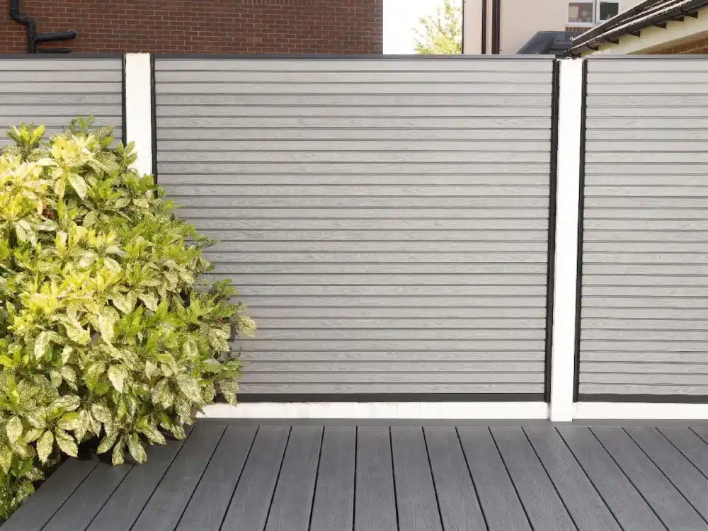 https://ultradecking.co.uk/wp-content/uploads/2026/03/Slatted-Light-Grey-Composite-Fencing-With-Dark-Grey-Decking.webp