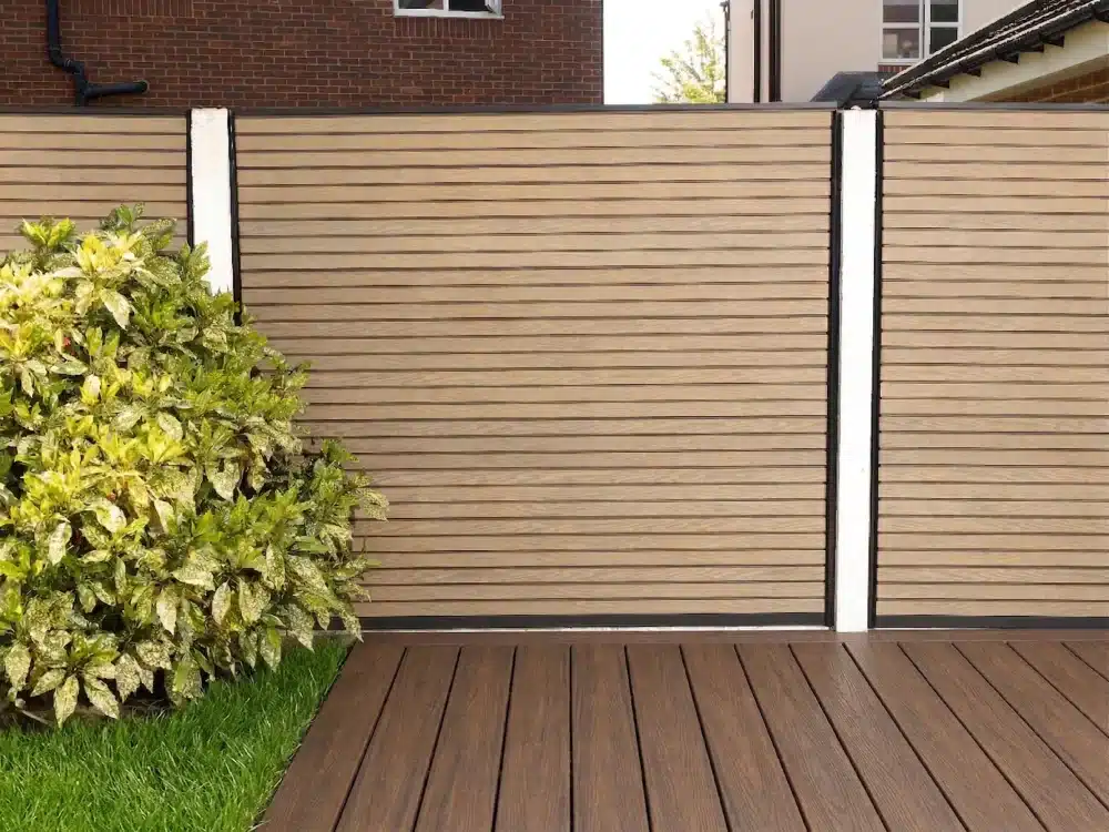 Slated Teak Composite Fence Panels With Walnut Composite Deck